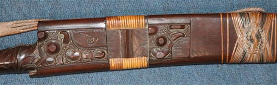 A Dayak stag horn-handled Mandau (head-hunters sword), wood scabbard, late 19th / early 20th century, total length 78.5cm (30.9in.)